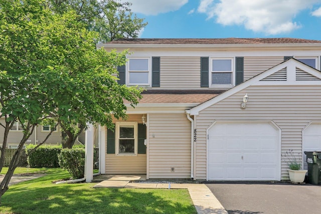 822 Texas Ct, Carol Stream, IL 60188 - view of front of house with a garage, a front lawn, roof with shingles, and driveway