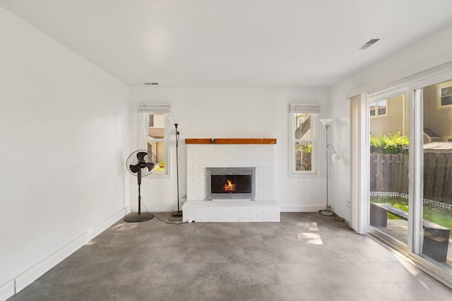 822 Texas Ct, Carol Stream, IL 60188 - unfurnished living room with a brick fireplace and baseboards