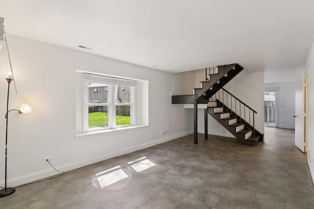 822 Texas Ct, Carol Stream, IL 60188 - unfurnished living room with stairs and baseboards