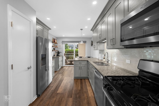 8909 Silverdale Dr Unit 5C, Orland Park, IL 60462 - kitchen with appliances with stainless steel finishes, gray cabinets, dark wood finished floors, light stone countertops, and decorative backsplash