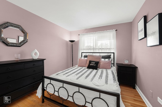 8909 Silverdale Dr Unit 5C, Orland Park, IL 60462 - bedroom featuring light wood-style flooring and baseboards