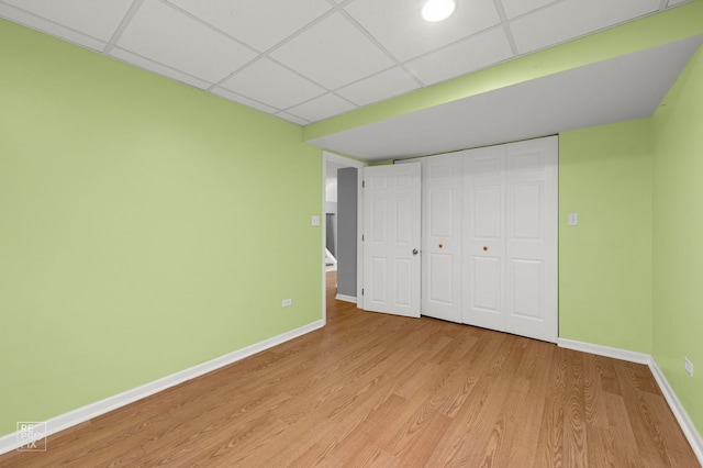 8909 Silverdale Dr Unit 5C, Orland Park, IL 60462 - unfurnished bedroom with a paneled ceiling, light wood-style flooring, and a closet
