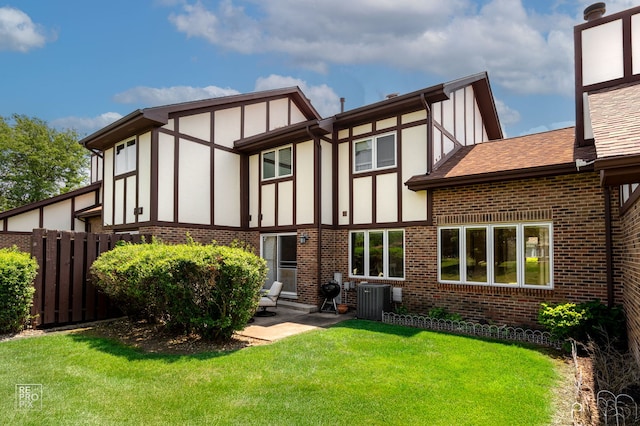 8909 Silverdale Dr Unit 5C, Orland Park, IL 60462 - back of property with brick siding, a patio, and a shingled roof