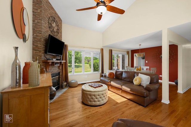 8909 Silverdale Dr Unit 5C, Orland Park, IL 60462 - living room with wood finished floors, a ceiling fan, high vaulted ceiling, and a large fireplace