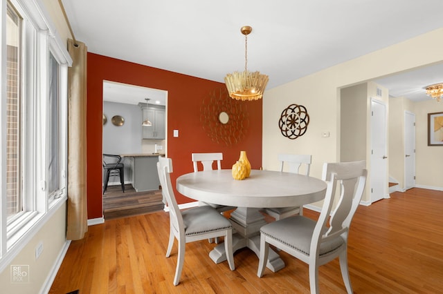 8909 Silverdale Dr Unit 5C, Orland Park, IL 60462 - dining space with a chandelier and light wood-style floors