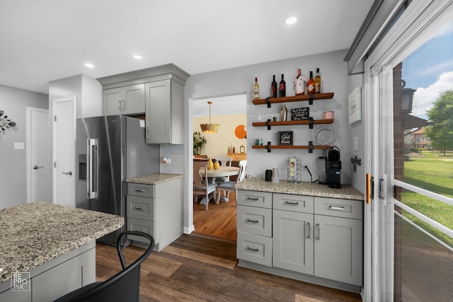 8909 Silverdale Dr Unit 5C, Orland Park, IL 60462 - kitchen with gray cabinetry, stainless steel fridge, dark wood-type flooring, light stone countertops, and open shelves