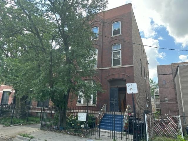 2349 W Grenshaw St, Chicago, IL 60612 - view of front of property with a fenced front yard, brick siding, and a gate