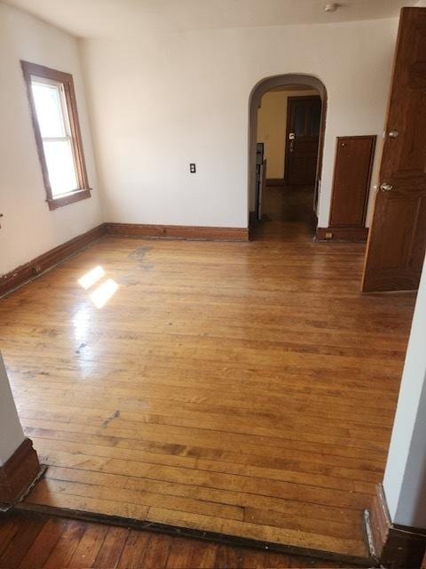 2349 W Grenshaw St, Chicago, IL 60612 - unfurnished room featuring hardwood / wood-style flooring and arched walkways