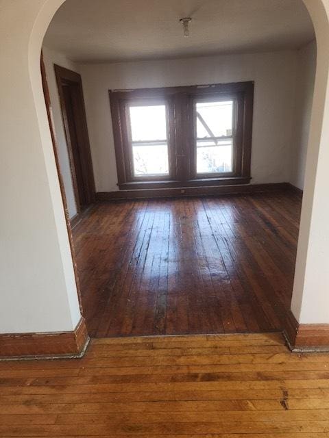 2349 W Grenshaw St, Chicago, IL 60612 - empty room featuring hardwood / wood-style floors and arched walkways