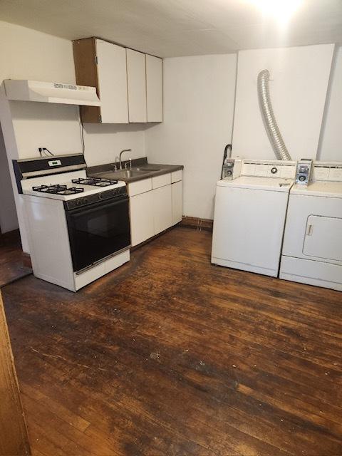 2349 W Grenshaw St, Chicago, IL 60612 - kitchen with white range with gas stovetop, independent washer and dryer, under cabinet range hood, and dark wood finished floors