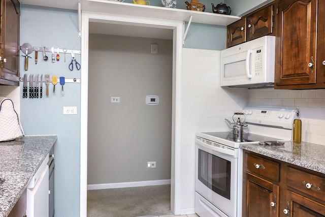 601 Lake Hinsdale Dr Unit 209, Willowbrook, IL 60527 - kitchen with white appliances, decorative backsplash, dark brown cabinets, and light stone counters