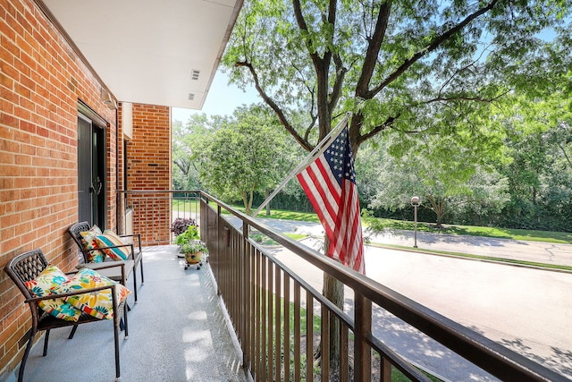 601 Lake Hinsdale Dr Unit 209, Willowbrook, IL 60527 - balcony featuring view of scattered trees