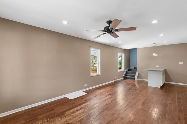 3326 W 107th St, Chicago, IL 60655 - empty room with stairway, a ceiling fan, dark wood-type flooring, and recessed lighting