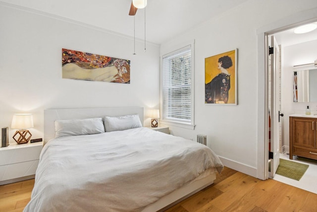 6329 N Wayne Ave Unit 3N, Chicago, IL 60660 - bedroom featuring light wood-style floors, ornamental molding, radiator, and ceiling fan