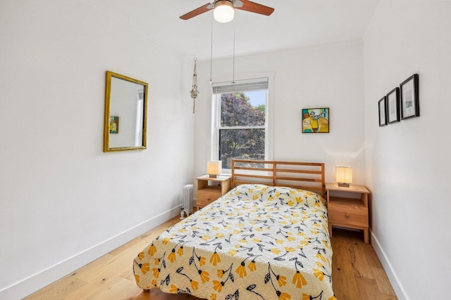 6329 N Wayne Ave Unit 3N, Chicago, IL 60660 - bedroom with radiator, light wood finished floors, crown molding, and a ceiling fan