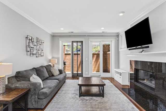 3938 N Southport Ave Unit G, Chicago, IL 60613 - living area with a tiled fireplace, crown molding, wood finished floors, and recessed lighting
