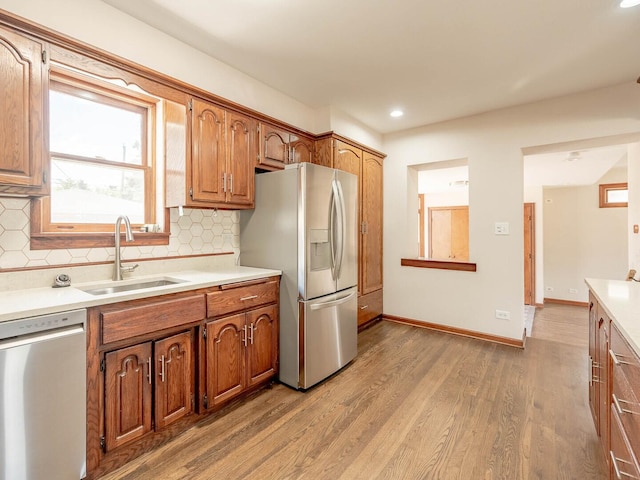 321 E Morningside Ave, Lombard, IL 60148 - kitchen featuring stainless steel appliances, light wood finished floors, tasteful backsplash, light countertops, and recessed lighting