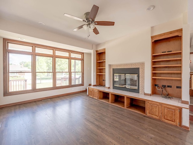 321 E Morningside Ave, Lombard, IL 60148 - unfurnished living room with a ceiling fan, wood finished floors, a glass covered fireplace, built in shelves, and recessed lighting