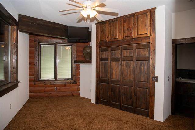 2003 W Hanover Rd, Hanover, IL 61041 - unfurnished bedroom featuring carpet floors and ceiling fan