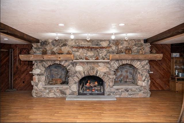 2003 W Hanover Rd, Hanover, IL 61041 - living room featuring a fireplace, wood finished floors, and beamed ceiling