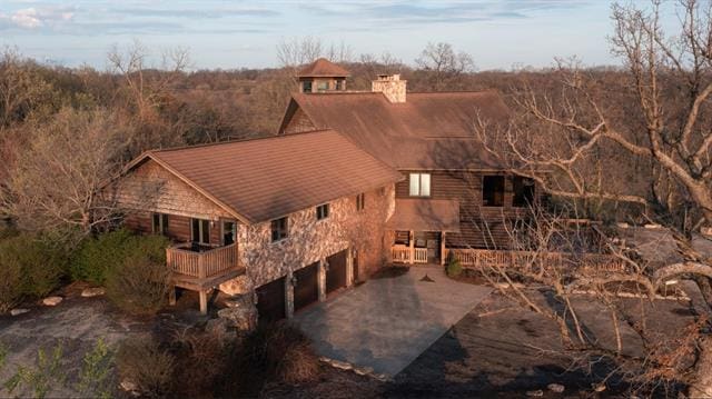 2003 W Hanover Rd, Hanover, IL 61041 - rear view of property with driveway, a garage, and a chimney
