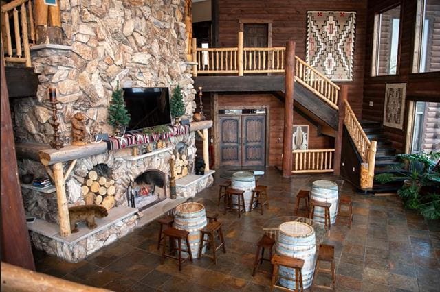 2003 W Hanover Rd, Hanover, IL 61041 - living area featuring a fireplace, stone finish floors, and stairs
