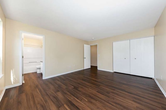2054 Trafalger Ct, Romeoville, IL 60446 - unfurnished bedroom with dark wood-style flooring, a closet, and ensuite bathroom