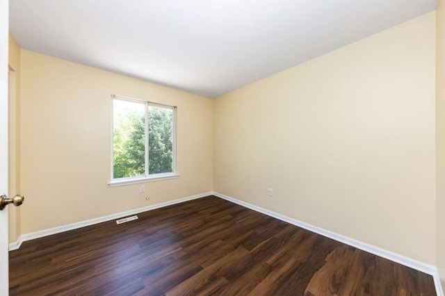2054 Trafalger Ct, Romeoville, IL 60446 - empty room with dark wood finished floors and baseboards