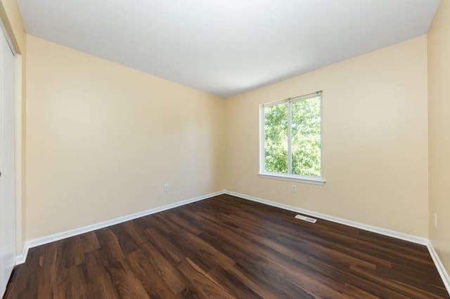 2054 Trafalger Ct, Romeoville, IL 60446 - unfurnished room with baseboards and dark wood-style floors