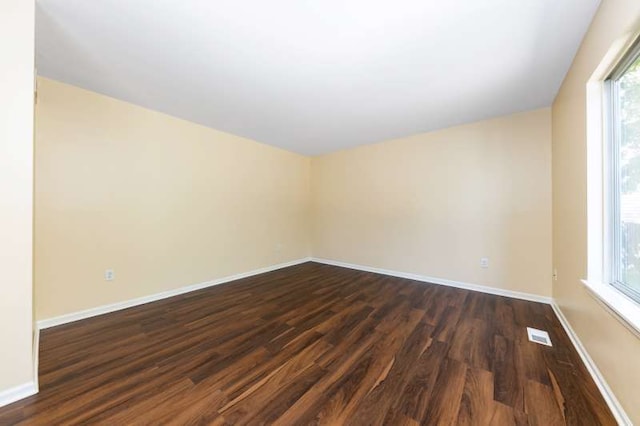 2054 Trafalger Ct, Romeoville, IL 60446 - spare room featuring dark wood finished floors and plenty of natural light