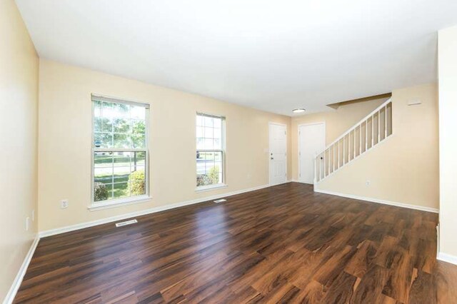 2054 Trafalger Ct, Romeoville, IL 60446 - unfurnished living room featuring dark wood-style floors and stairway