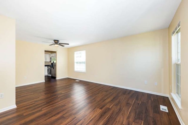 2054 Trafalger Ct, Romeoville, IL 60446 - unfurnished living room featuring dark wood-type flooring and a ceiling fan