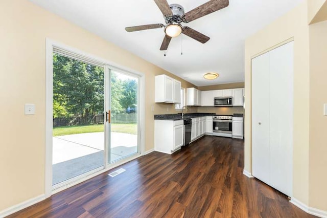 2054 Trafalger Ct, Romeoville, IL 60446 - kitchen with stainless steel appliances, dark wood finished floors, white cabinets, dark countertops, and ceiling fan
