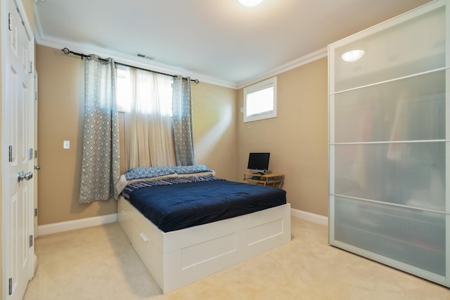 453 N May St Unit Gs, Chicago, IL 60642 - bedroom with ornamental molding, light carpet, and an office area