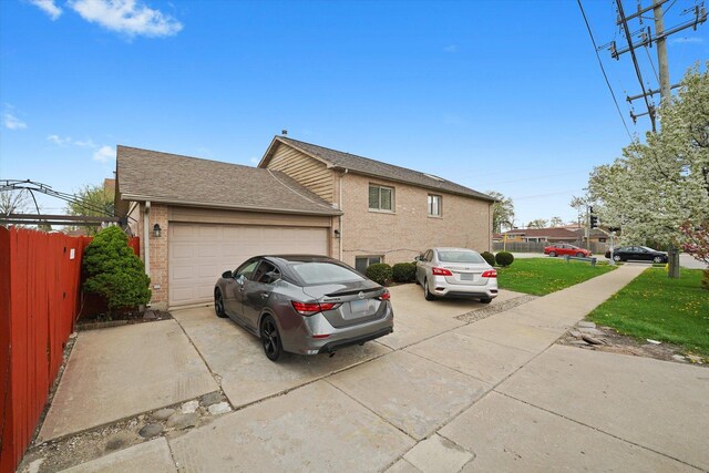 9631 Fullerton Ave, Franklin Park, IL 60131 - view of home's exterior with brick siding, an attached garage, driveway, and roof with shingles