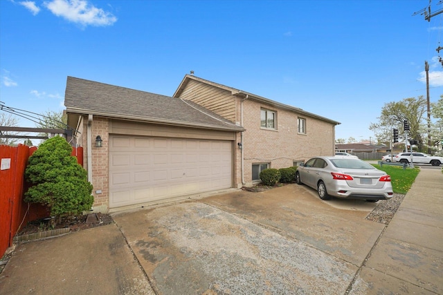 9631 Fullerton Ave, Franklin Park, IL 60131 - view of home's exterior featuring brick siding, concrete driveway, and an attached garage
