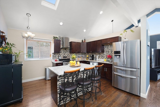 9631 Fullerton Ave, Franklin Park, IL 60131 - kitchen featuring appliances with stainless steel finishes, wall chimney range hood, tasteful backsplash, dark brown cabinetry, and dark wood finished floors