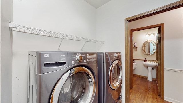 1389 Lily Cache Ln, Bolingbrook, IL 60490 - washroom featuring washing machine and clothes dryer and wood finished floors