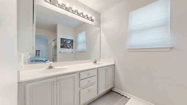 1389 Lily Cache Ln, Bolingbrook, IL 60490 - ensuite bathroom with double vanity and baseboards