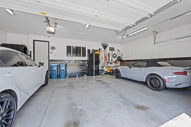 3462 Ayres Dr, Aurora, IL 60506 - garage featuring a garage door opener and freestanding refrigerator