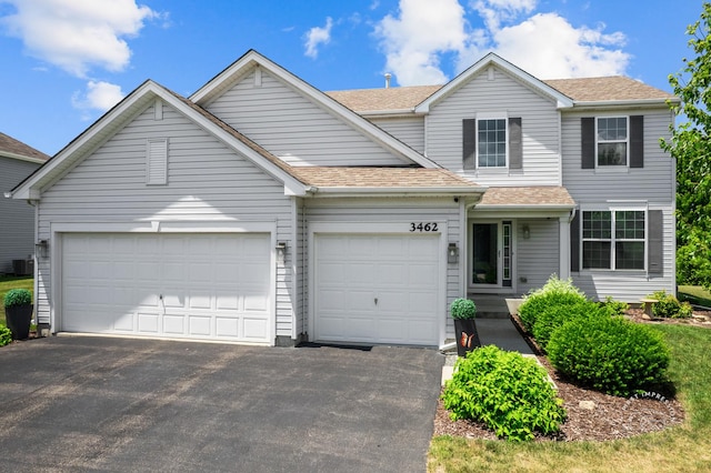 3462 Ayres Dr, Aurora, IL 60506 - traditional-style house featuring driveway, a garage, and a shingled roof