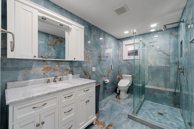 8313 W Ballard Rd, Niles, IL 60714 - full bathroom with marble look tile flooring, vanity, a marble finish shower, and tile walls