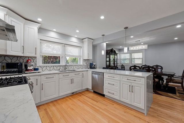 8313 W Ballard Rd, Niles, IL 60714 - kitchen featuring stainless steel dishwasher, light wood-style flooring, decorative backsplash, white cabinetry, and recessed lighting