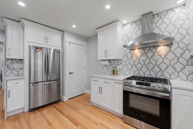 8313 W Ballard Rd, Niles, IL 60714 - kitchen with appliances with stainless steel finishes, wall chimney exhaust hood, recessed lighting, tasteful backsplash, and light wood finished floors
