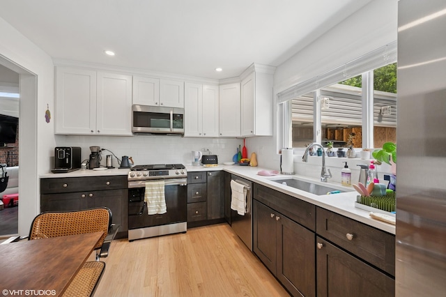1429 Ferndale Ave, Highland Park, IL 60035 - kitchen featuring stainless steel appliances, white cabinetry, light countertops, light wood-style flooring, and recessed lighting