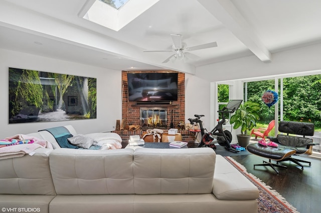 1429 Ferndale Ave, Highland Park, IL 60035 - living area with wood finished floors, beamed ceiling, a fireplace, a skylight, and ceiling fan