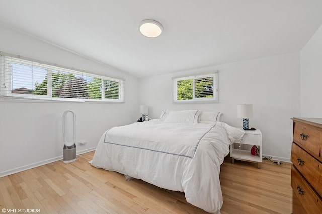 1429 Ferndale Ave, Highland Park, IL 60035 - bedroom featuring light wood-style floors, multiple windows, and lofted ceiling