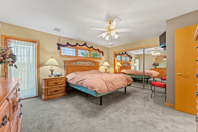1422 Pier Dr, Lake Summerset, IL 61019 - bedroom with light colored carpet, a closet, a textured ceiling, and ceiling fan