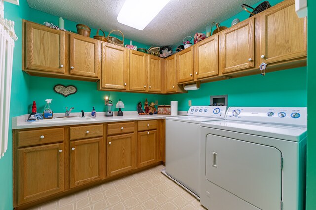 1422 Pier Dr, Lake Summerset, IL 61019 - laundry area with washer and clothes dryer, cabinet space, a textured ceiling, and light flooring