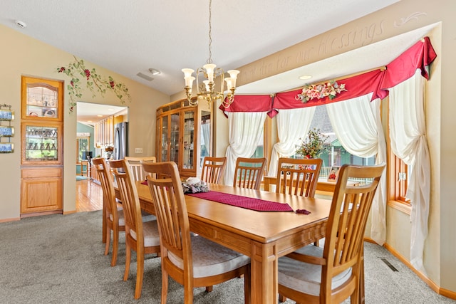 1422 Pier Dr, Lake Summerset, IL 61019 - dining room with a chandelier, lofted ceiling, light carpet, and a textured ceiling